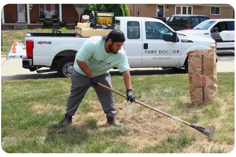 turf doctor tech working on lawn